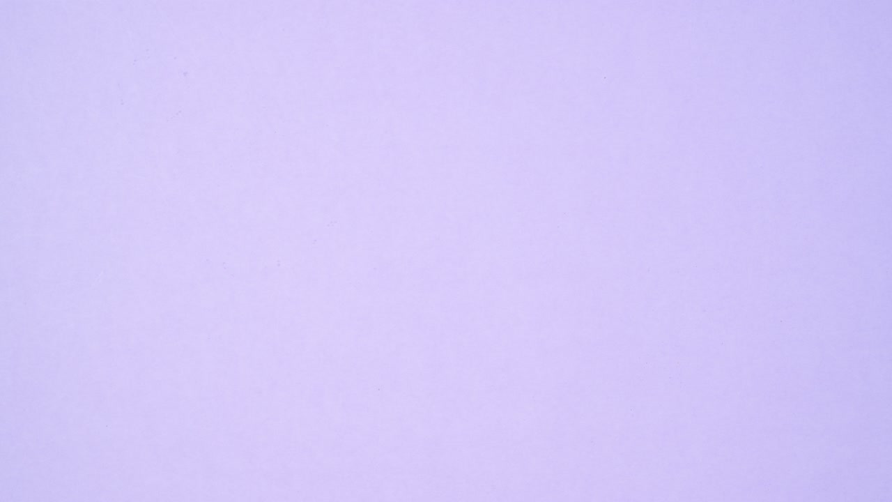 Cookies biscuits appear in white ceramic plate on light purple theme. Stop motion flat lay