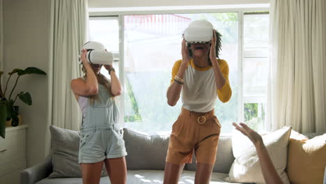 diverse female friends trying virtual reality headsets, excited about immersive experience, at home