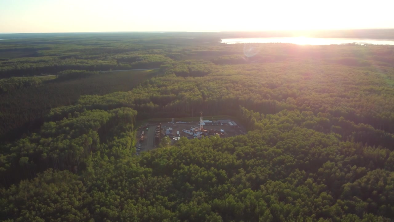 Active Drilling Rig Surrounded by Boreal Forest in Summer