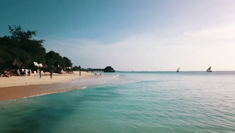 Gorgeous-fast-aerial-flight-forwards-drone-shot-on-coast-line-with-the-wave-crystal-clear-turquoise-water