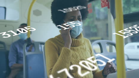 person wearing mask on bus with floating numbers animation over scene
