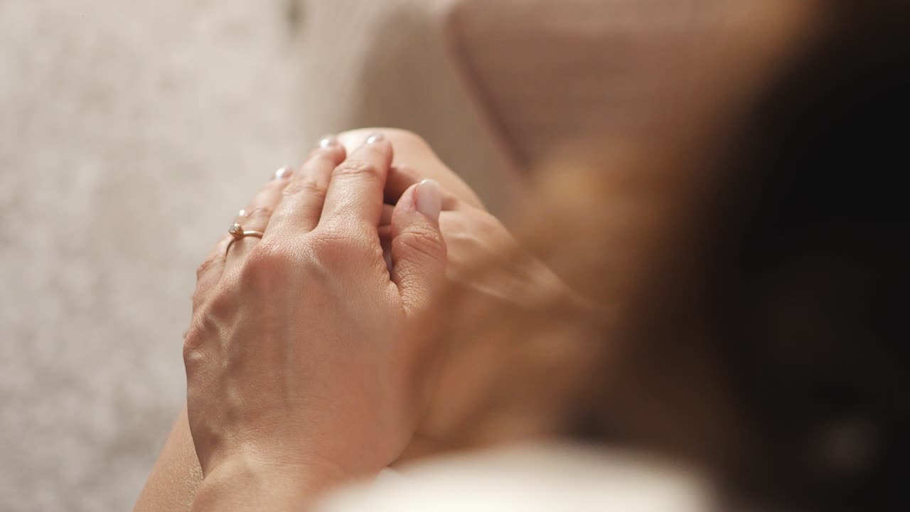 Hands holding each other warmly, conveying comfort and closeness