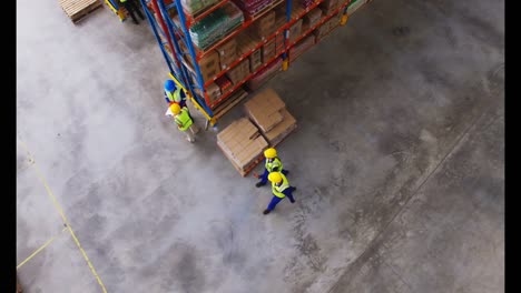 Warehouse-worker-interacting-with-each-other-while-walking