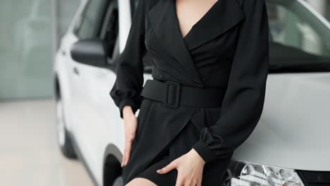 close-up of a female figure dressed in a black dress