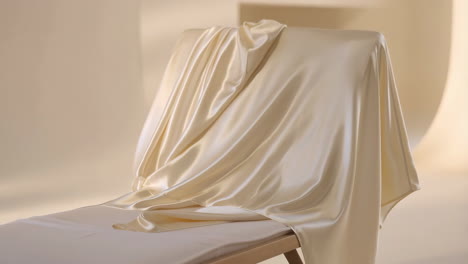 elegant cream silk fabric draped with soft folds