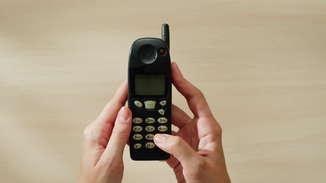 Vintage Cell Phone in Hands