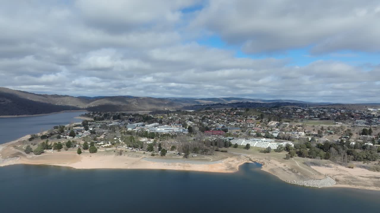 Aerial wide shot of Jindabyne on a cloudy day, Australia