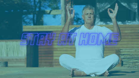 animation of blue neon words stay at home over caucasian man meditating