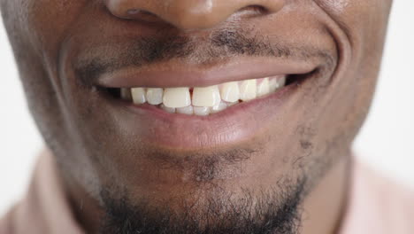 close up african american man mouth smiling cheerful happy showing healthy white teeth dental health concept