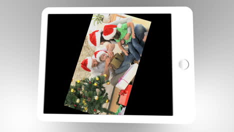 tablet being used to watch two short christmas related family films with scrolling at the start
