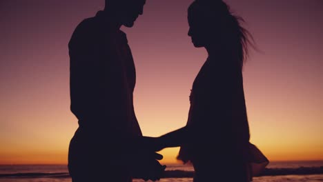 young couple by the sea