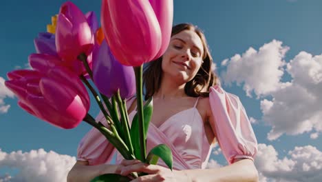 woman with colorful tulips bouquet