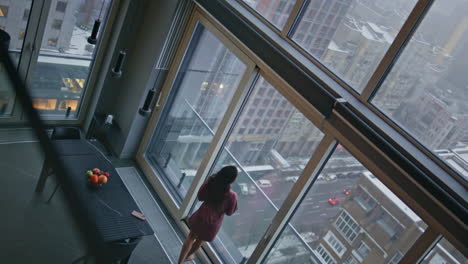 domestic woman thinking future looking panoramic window in flat high angle shot