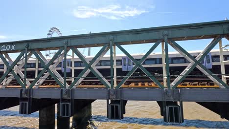 train moving across hungerford bridge in london