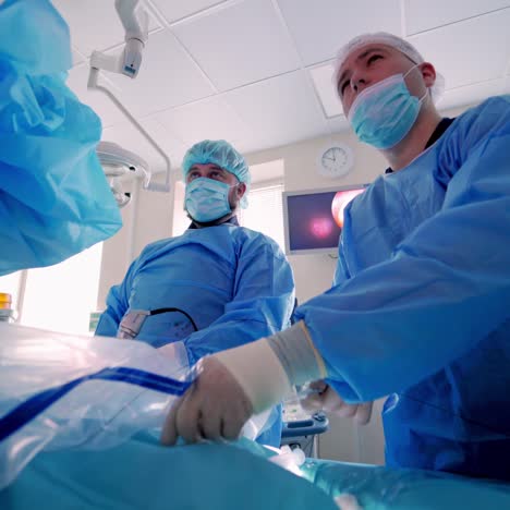 team surgeon at work in operating room