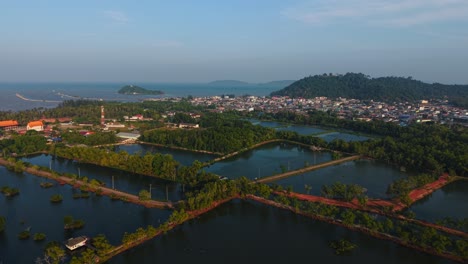 aerial view of coastal town and fish farm