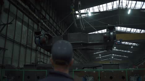 heavy machinery lifting process in industrial setting