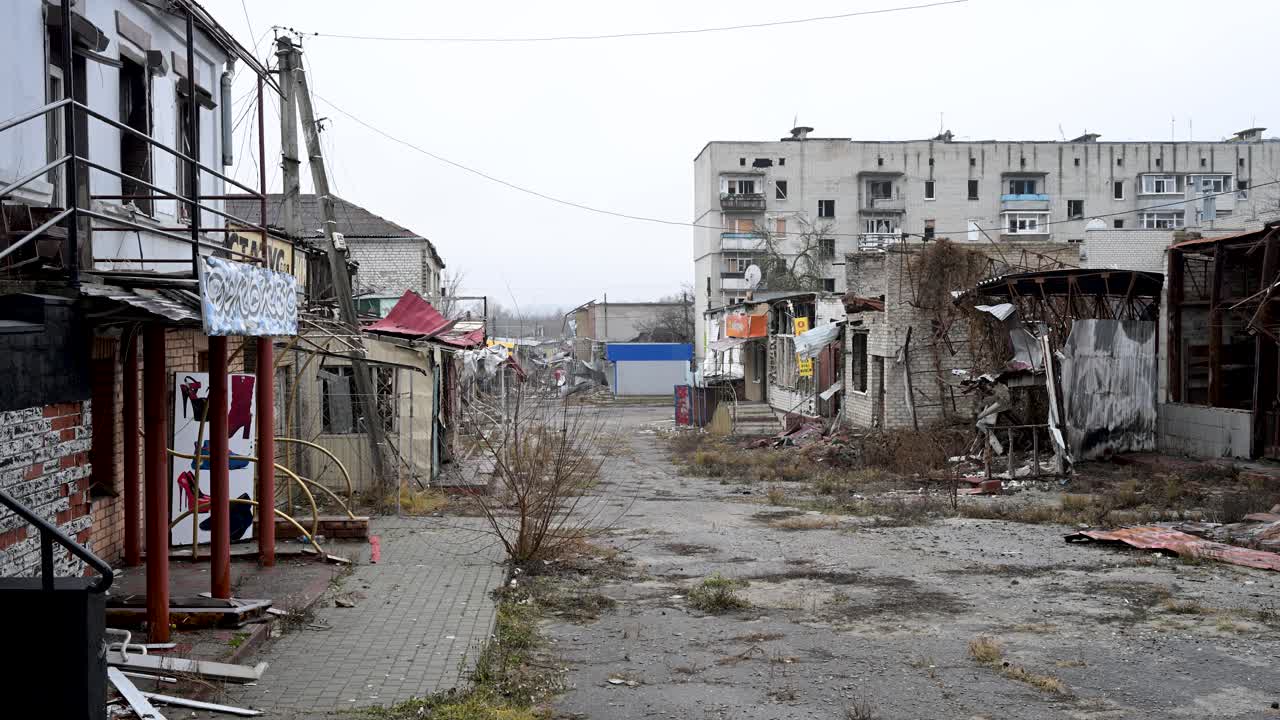 The ruins of what was once a bustling market alley and businesses in Kupiansk, Ukraine. Now abandoned, the shattered stalls and debris show the devastating impact of war on this frontline city