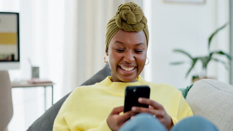 Happy,-black-woman-on-sofa