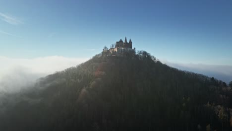 the drone orbits right around hohenzollern castle, capturing its stunning architecture and the breathtaking german countryside.