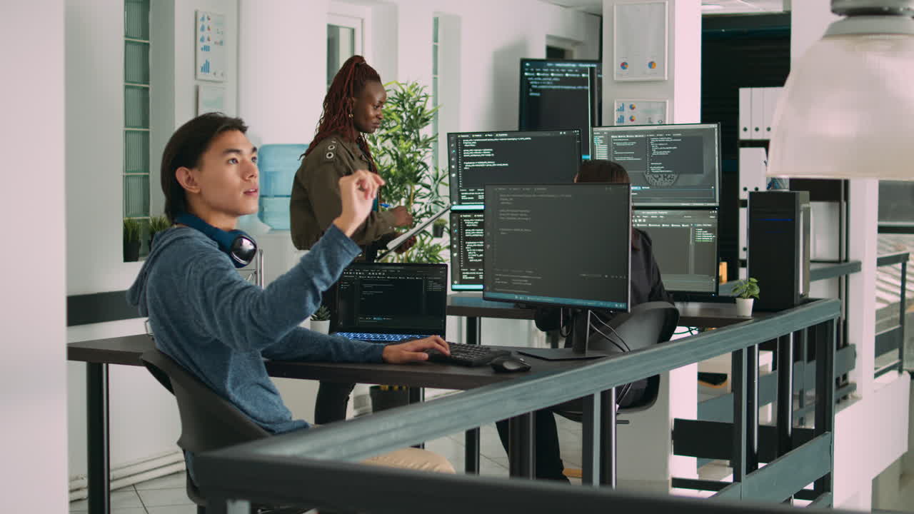 Digital developer analyzing ar hologram to work on html script