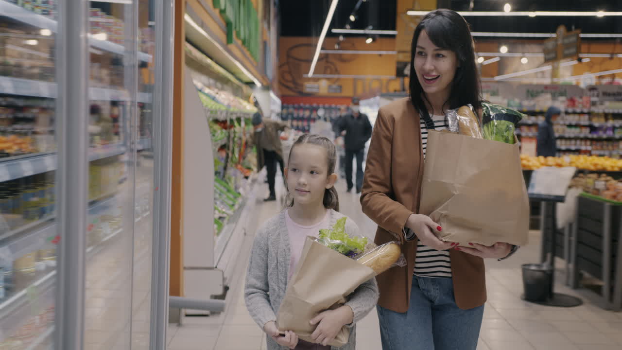 Mother and Daughter Shopping for Groceries