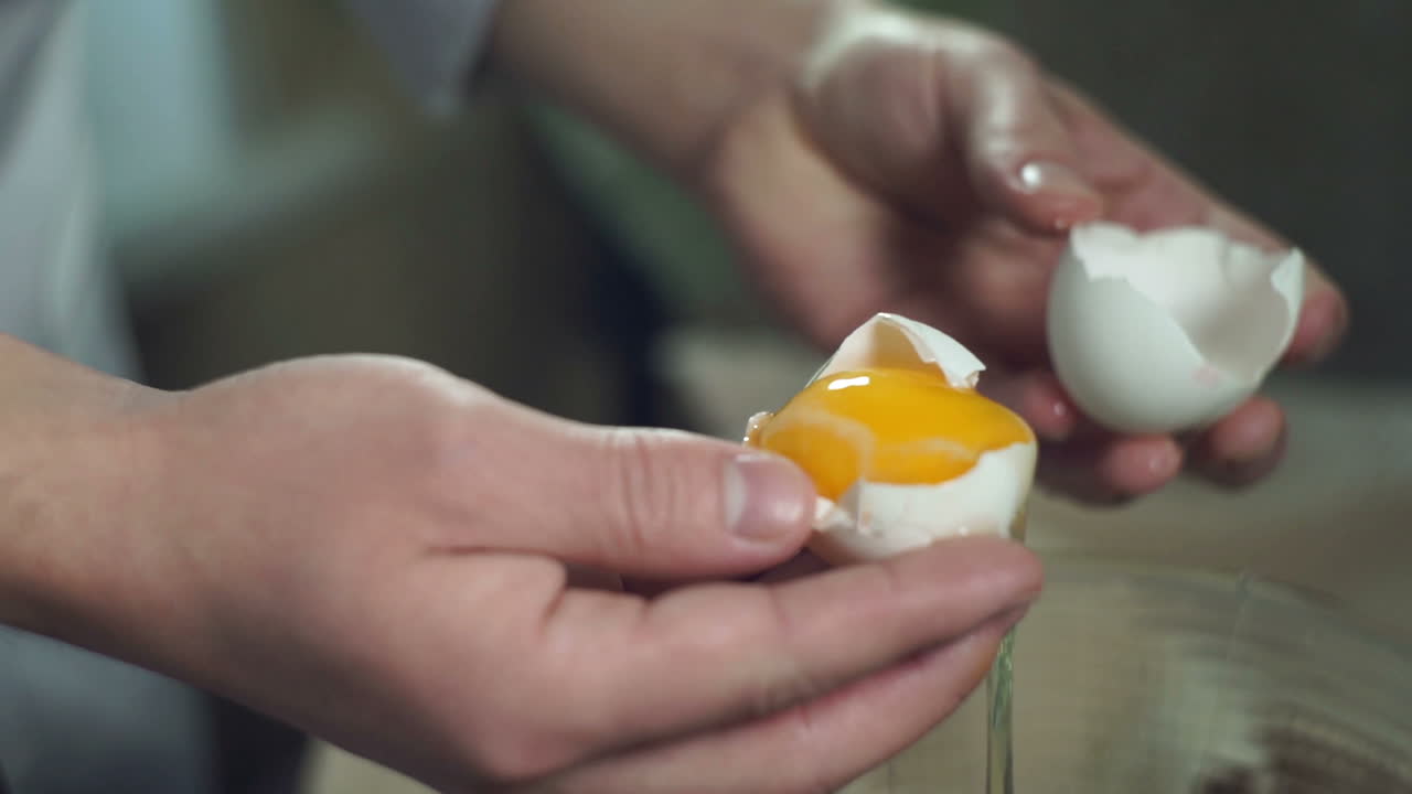 Chef cooking food. Break egg. Closeup. Cooking food. Baking ingredients