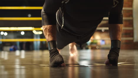 focused sport man warming up at gym