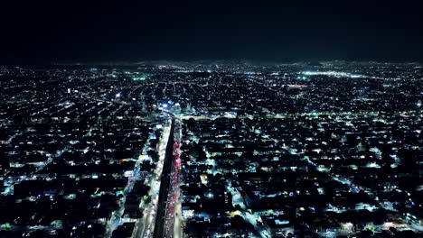 lateral shot of mexico city at night time, residential area view