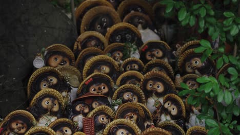 tanuki statues at awashima shrine, kada, wakayama prefecture japan