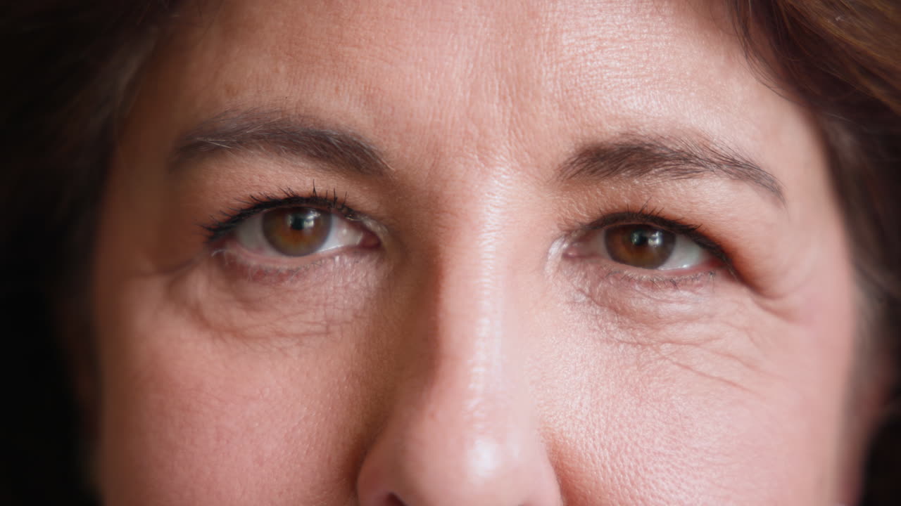Close-up of senior woman smiling warmly, showing joy and happiness