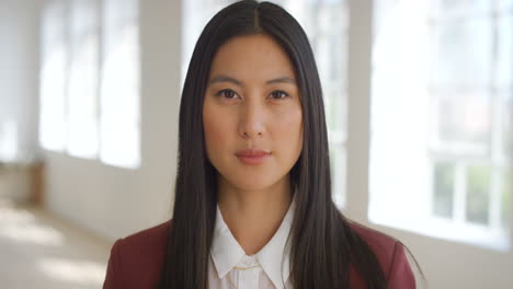 Portrait-of-a-young-female-student-standing