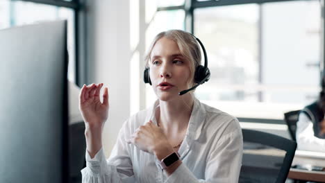 customer service representative wearing headset in office