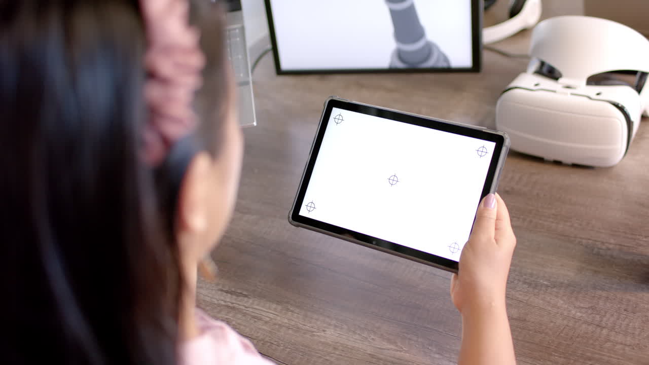 Holding tablet, woman interacting with robotic interface in modern office, copy space
