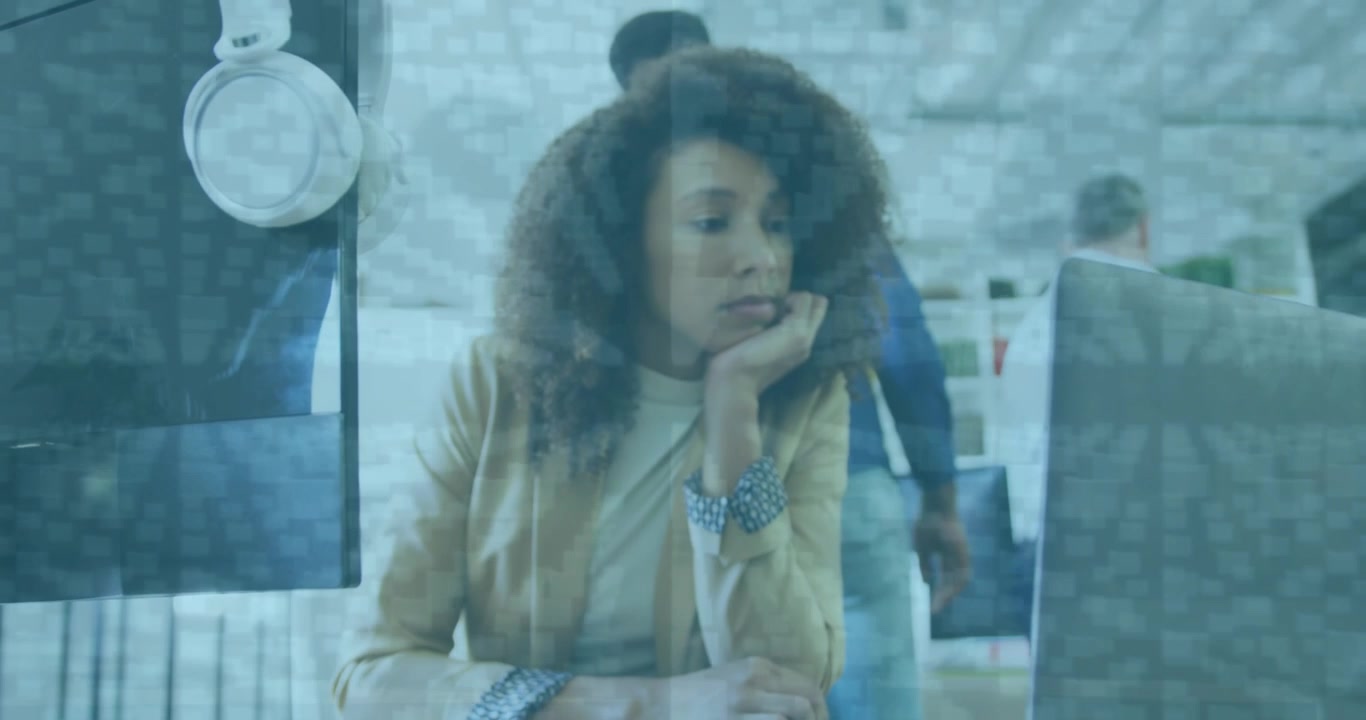 Animation of data processing over african american businesswoman using laptop at office