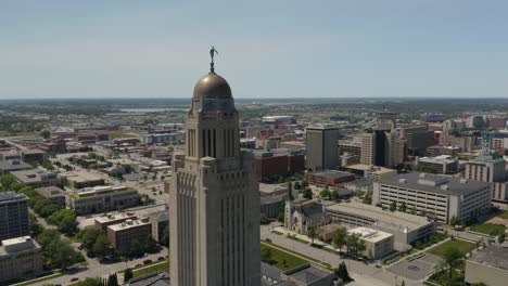 drone flies away from nebraska statehouse located in downtown lincoln