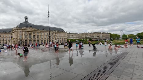 people enjoying mist at place de la bourse