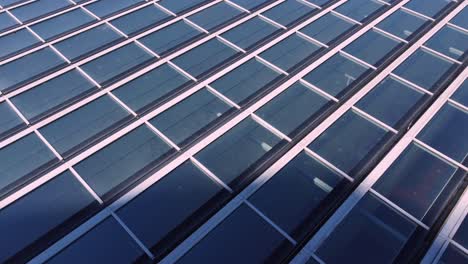 Full-screen-of-roof-windows,-aerial-drone-closeup-view-of-modern-roofing,-copy-space