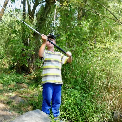 boy fishing in a forest