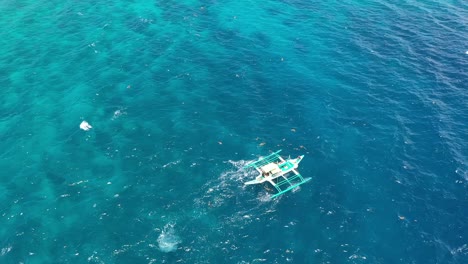 Traditional-vessel-at-sun-sea-shore-closeup-aerial-view