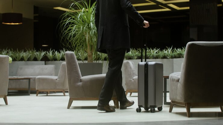 Man approaching the hotel reception desk