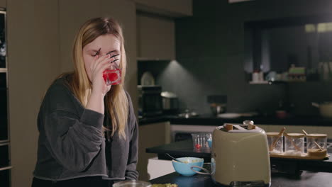 woman having breakfast in the kitchen