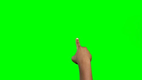 Person making hand gesture against green screen background