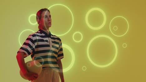 animation of neon circles over female rugby player on neon background