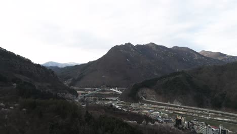 aerial drone shot hills and mountains in chuncheon city gangwon province, south korea