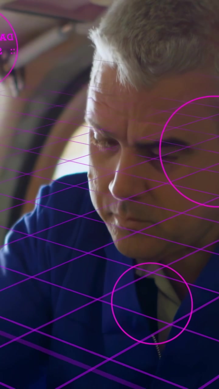 Vertical video: Tech reacting to magenta AR tags turning driver on part, grid guiding repair