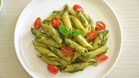 penne pasta with pesto sauce and tomatoes - vegan and vegetarian food style