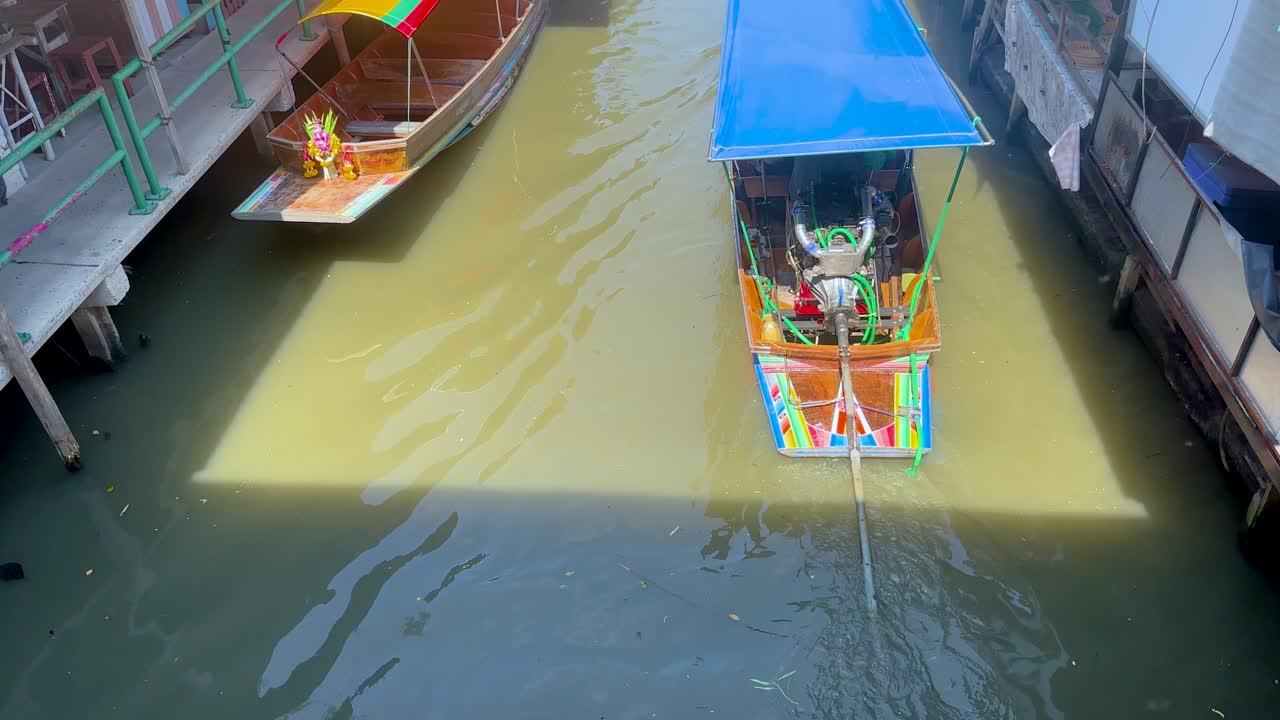 Colorful boats navigate Khlong Lat Mayom canal