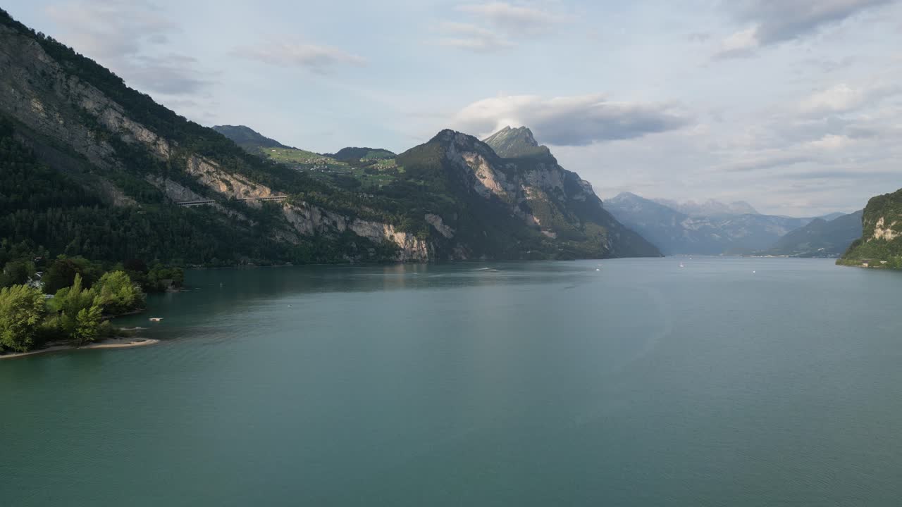 Backward shot of lake in G&auml;si Betlis, Walensee Glarus, Weesen Walenstadt, Switzerland- drone view