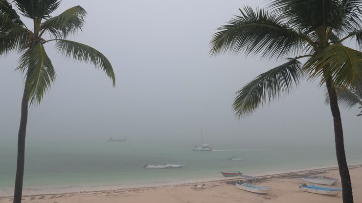 View on Storm and rain on tropical beach from balcony. Stormy weather
